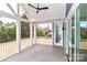 Covered porch featuring a ceiling fan, sliding glass doors, and an outdoor seating area at 332 Canvasback Rd, Mooresville, NC 28117