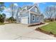Two-story home featuring an attached garage and an expansive driveway at 332 Canvasback Rd, Mooresville, NC 28117