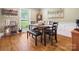 A formal dining room features a wooden table with seating and hardwood flooring at 3367 Tanglewood Dr, Rock Hill, SC 29732