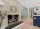 Charming brick fireplace with decorative wreath, adding a cozy ambiance to the connected kitchen and living spaces at 3367 Tanglewood Dr, Rock Hill, SC 29732