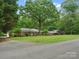 Charming brick home with a manicured lawn and mature trees, creating a serene and inviting curb appeal at 3367 Tanglewood Dr, Rock Hill, SC 29732