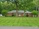 Charming brick home with a manicured lawn and mature trees, creating a serene and inviting curb appeal at 3367 Tanglewood Dr, Rock Hill, SC 29732
