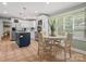 Spacious kitchen with white cabinetry, stainless steel appliances, and adjacent breakfast nook at 3367 Tanglewood Dr, Rock Hill, SC 29732