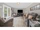 Inviting living room features hardwood flooring, cozy furniture, and bright French doors at 3367 Tanglewood Dr, Rock Hill, SC 29732