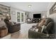 Comfortable living room with hardwood floors, plush seating, and French doors leading to outdoor views at 3367 Tanglewood Dr, Rock Hill, SC 29732
