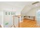 Bright attic space featuring hardwood floors, custom desk space, and multiple windows at 3916 Blowing Rock Way, Charlotte, NC 28210