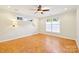 Bedroom boasts parquet floors, ceiling fan, and large windows at 3916 Blowing Rock Way, Charlotte, NC 28210