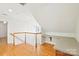 Bright bonus room features hardwood floors, desk area, and natural light at 3916 Blowing Rock Way, Charlotte, NC 28210
