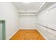 Walk-in closet with hardwood floors and built-in shelving at 3916 Blowing Rock Way, Charlotte, NC 28210