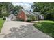 Spacious concrete driveway leading to a detached garage, complementing the home's exterior at 3916 Blowing Rock Way, Charlotte, NC 28210