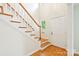 Bright foyer with hardwood floors, a staircase, and a white front door, offering a welcoming entrance at 3916 Blowing Rock Way, Charlotte, NC 28210