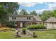 Charming two-story home with a well-manicured lawn, a brick-and-siding facade, and an inviting backyard patio at 3916 Blowing Rock Way, Charlotte, NC 28210