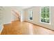 Bright living room with hardwood floors, and large windows for natural light at 3916 Blowing Rock Way, Charlotte, NC 28210