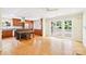 Open concept living space features hardwood floors, sliding glass doors, and natural light at 3916 Blowing Rock Way, Charlotte, NC 28210