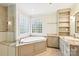 Main bathroom boasts soaking tub, glass shower, granite counters and shelving at 3916 Blowing Rock Way, Charlotte, NC 28210