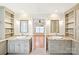 Main bathroom with double vanity, granite counters, and decorative mirrors at 3916 Blowing Rock Way, Charlotte, NC 28210