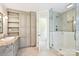 Bright main bathroom features granite counters, a glass shower, and custom cabinetry at 3916 Blowing Rock Way, Charlotte, NC 28210