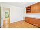 Office features parquet flooring, built-in shelves, and bright doorway at 3916 Blowing Rock Way, Charlotte, NC 28210