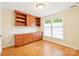 Office with parquet flooring, built-in shelving, and bright windows at 3916 Blowing Rock Way, Charlotte, NC 28210