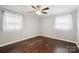 Cozy bedroom featuring natural light, hardwood floors, and neutral colored walls at 407 Cherry St, Belmont, NC 28012