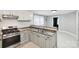 Bright kitchen with modern appliances, stone countertops, and ample cabinet space at 407 Cherry St, Belmont, NC 28012