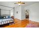 Bedroom featuring hardwood floors, a canopy bed, and natural light at 435 Sixteenth St, Cramerton, NC 28032