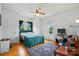Cozy bedroom features hardwood floors, a ceiling fan, and ample natural light at 435 Sixteenth St, Cramerton, NC 28032