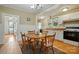 Well-lit kitchen with white cabinets, including a cozy dining area at 435 Sixteenth St, Cramerton, NC 28032