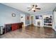 Spacious living room with hardwood flooring, fireplace, and built-in shelving for both functionality and style at 435 Sixteenth St, Cramerton, NC 28032