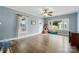 Bright and airy living room featuring hardwood floors, large windows, and neutral wall paint at 435 Sixteenth St, Cramerton, NC 28032