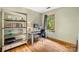 Office/Bedroom features a wooden desk, hardwood floors, lots of natural light, and neutral paint at 4848 Spicewood Dr, Charlotte, NC 28227