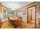 This sunny dining room features a bay window overlooking the backyard and wood floors at 4848 Spicewood Dr, Charlotte, NC 28227