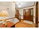 Inviting foyer with hardwood floors, wooden staircase, and traditional design elements at 4848 Spicewood Dr, Charlotte, NC 28227