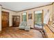 Cozy living room with hardwood floors, comfortable seating, and natural light from the windows at 4848 Spicewood Dr, Charlotte, NC 28227