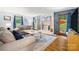 Comfortable living room with a brick fireplace, plush seating, and natural light at 4848 Spicewood Dr, Charlotte, NC 28227