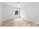 Comfortable bedroom with hardwood floors, a ceiling fan, and a closet at 4913 Seacroft Rd, Charlotte, NC 28210