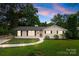 Charming, freshly renovated single-story home with manicured lawn and a welcoming walkway at 4913 Seacroft Rd, Charlotte, NC 28210