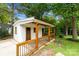 Charming outbuilding featuring a covered porch and updated details, perfect for a guest house or studio at 4913 Seacroft Rd, Charlotte, NC 28210