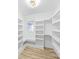 Walk-in closet with custom built-in shelving for optimal storage and organization at 4913 Seacroft Rd, Charlotte, NC 28210