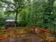 Back deck with decorative wood railings and lush backyard view at 5109 Goldcrest Dr, Indian Trail, NC 28079