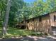 Backyard view featuring a wooden deck, fenced yard, and an attached garage at 5109 Goldcrest Dr, Indian Trail, NC 28079