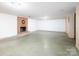 Unfinished basement featuring brick fireplace and neutral walls, ready for your design ideas at 5109 Goldcrest Dr, Indian Trail, NC 28079
