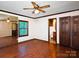 Bedroom with laminate floors, ceiling fan, and en suite bath at 5109 Goldcrest Dr, Indian Trail, NC 28079
