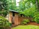Enclosed courtyard with brick walls, wrought iron gate, and decorative landscaping, creating a private outdoor space at 5109 Goldcrest Dr, Indian Trail, NC 28079