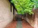 Brick house with a side entrance and walkway, adding charm to the landscape at 5109 Goldcrest Dr, Indian Trail, NC 28079
