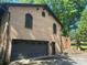 Exterior view of the detached brick garage, showing its doors, windows, and separate entrance at 5109 Goldcrest Dr, Indian Trail, NC 28079