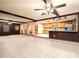 Open-concept living area with tile floors, wood accents, and a view of the kitchen, ideal for entertaining at 5109 Goldcrest Dr, Indian Trail, NC 28079