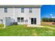 This backyard features green grass, a fence, and a patio at 5137 Hyrule Dr, Charlotte, NC 28262