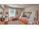 Bedroom featuring a bed with canopy, desk, and window at 5137 Hyrule Dr, Charlotte, NC 28262
