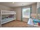 Charming bedroom with bunk beds, neutral decor, and natural light creates a warm, inviting space at 5137 Hyrule Dr, Charlotte, NC 28262